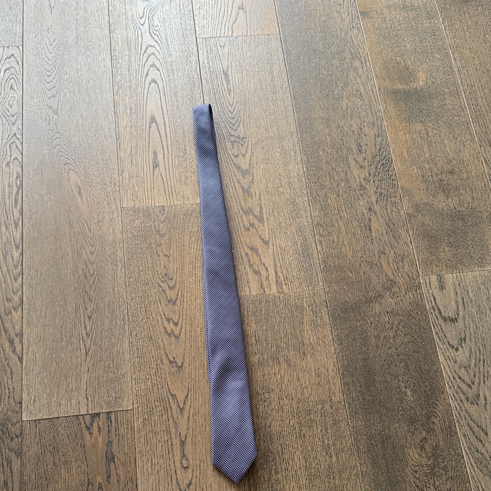 Men’s blue and white polka dot tie.